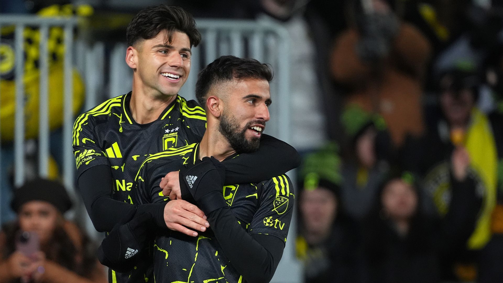 Max Arfsten and Diego Rossi celebrate together after Rossi's goal