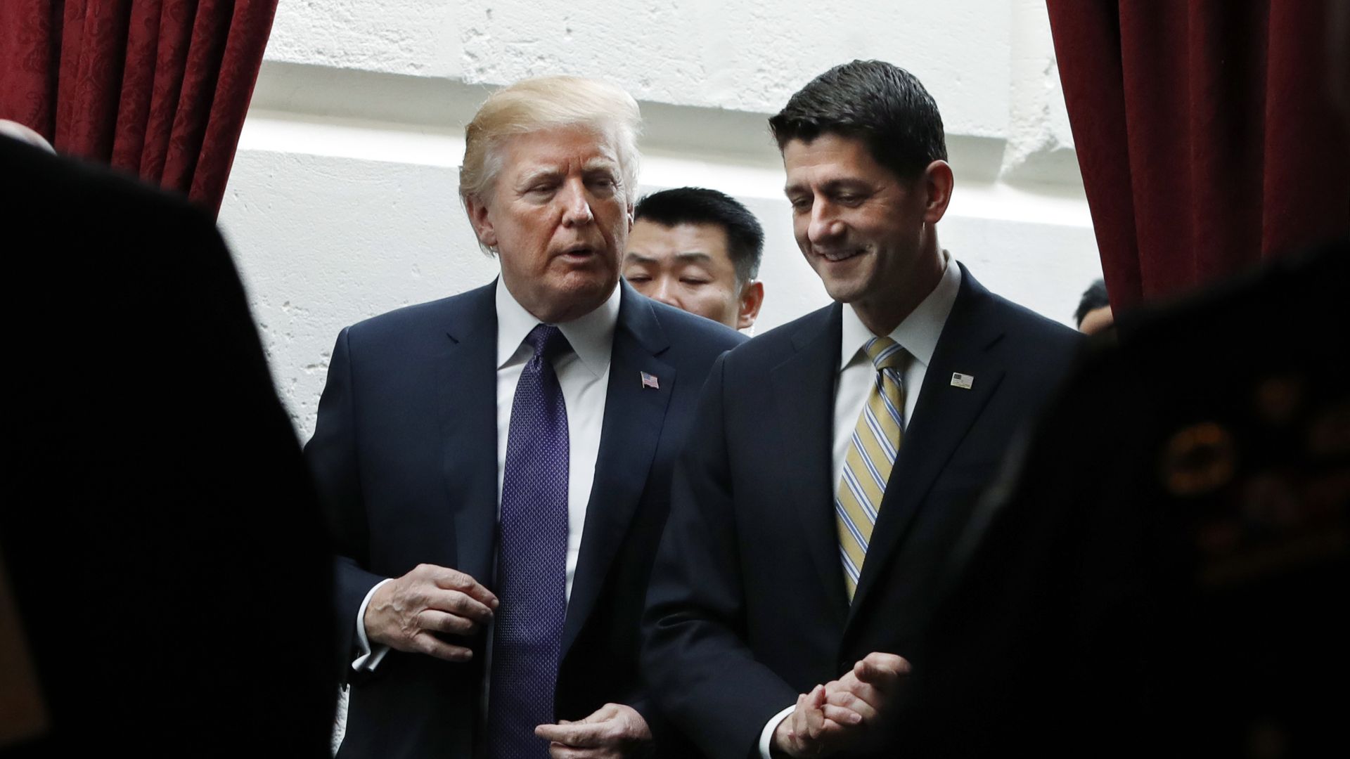 President Donald Trump walks with House Speaker Paul Ryan. 