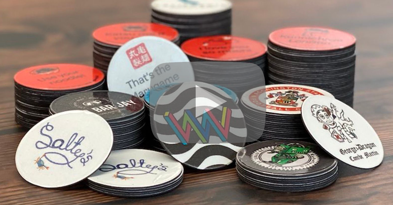Round magnets, about the size of a poker chip, are printed with slogans and fit in the bottom of a beer glass.