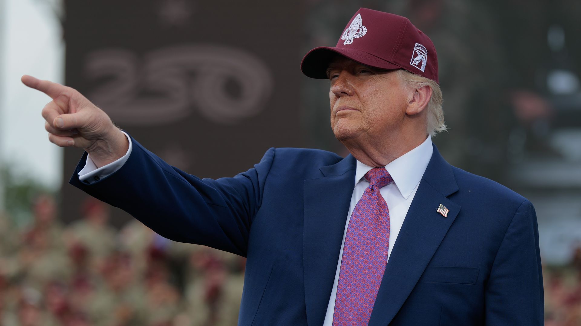 President Donald Trump takes the stage during a rally with U.S. Army troops on June 10, 2025 at Fort Bragg, North Carolina. Trump is traveling to Fort Bragg Army base to observe a military demonstration 