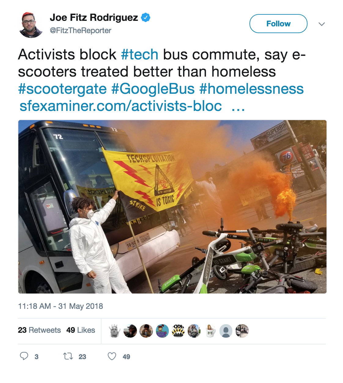 Tweet showing housing activists burning pile of scooters in front of buses carrying tech people