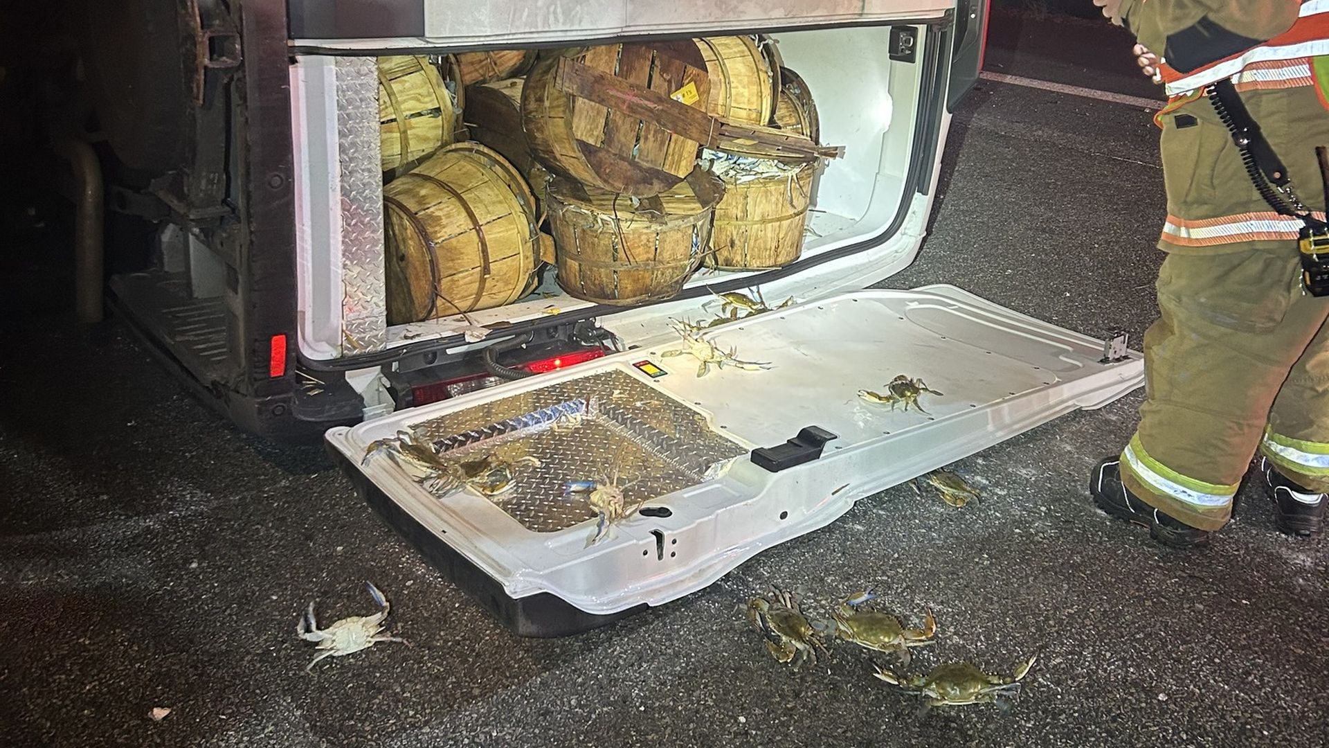 an overturned truck with crabs coming out 