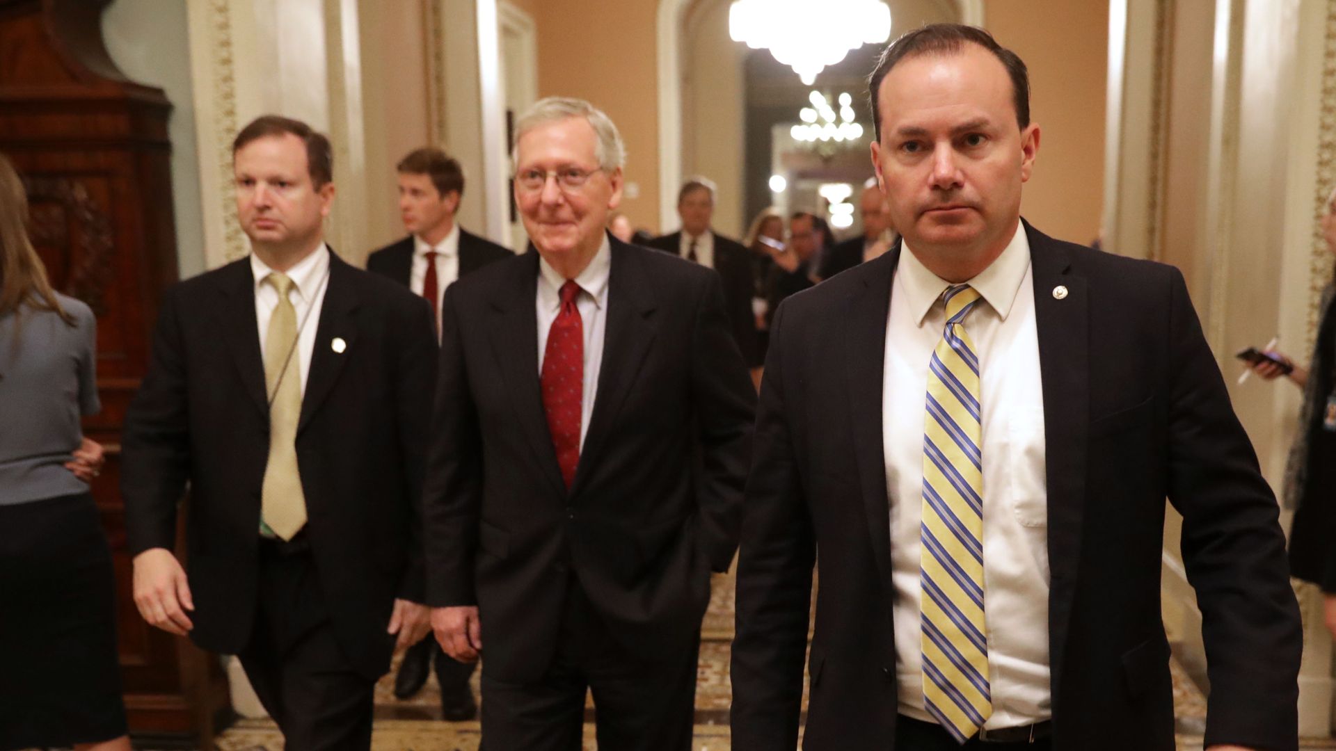 Mitch McConnell and Mike Lee walk.