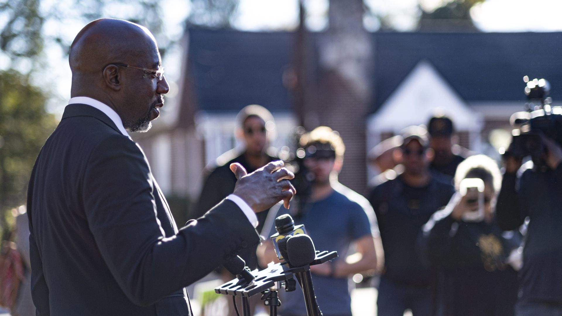 Raphael Warnock speaks to reporters