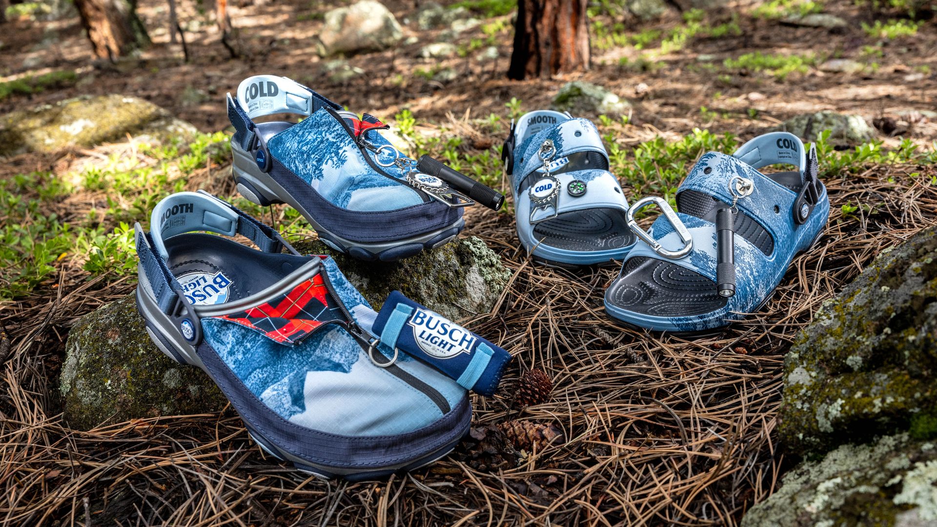 Pairs of busch light crocs on a forest floor