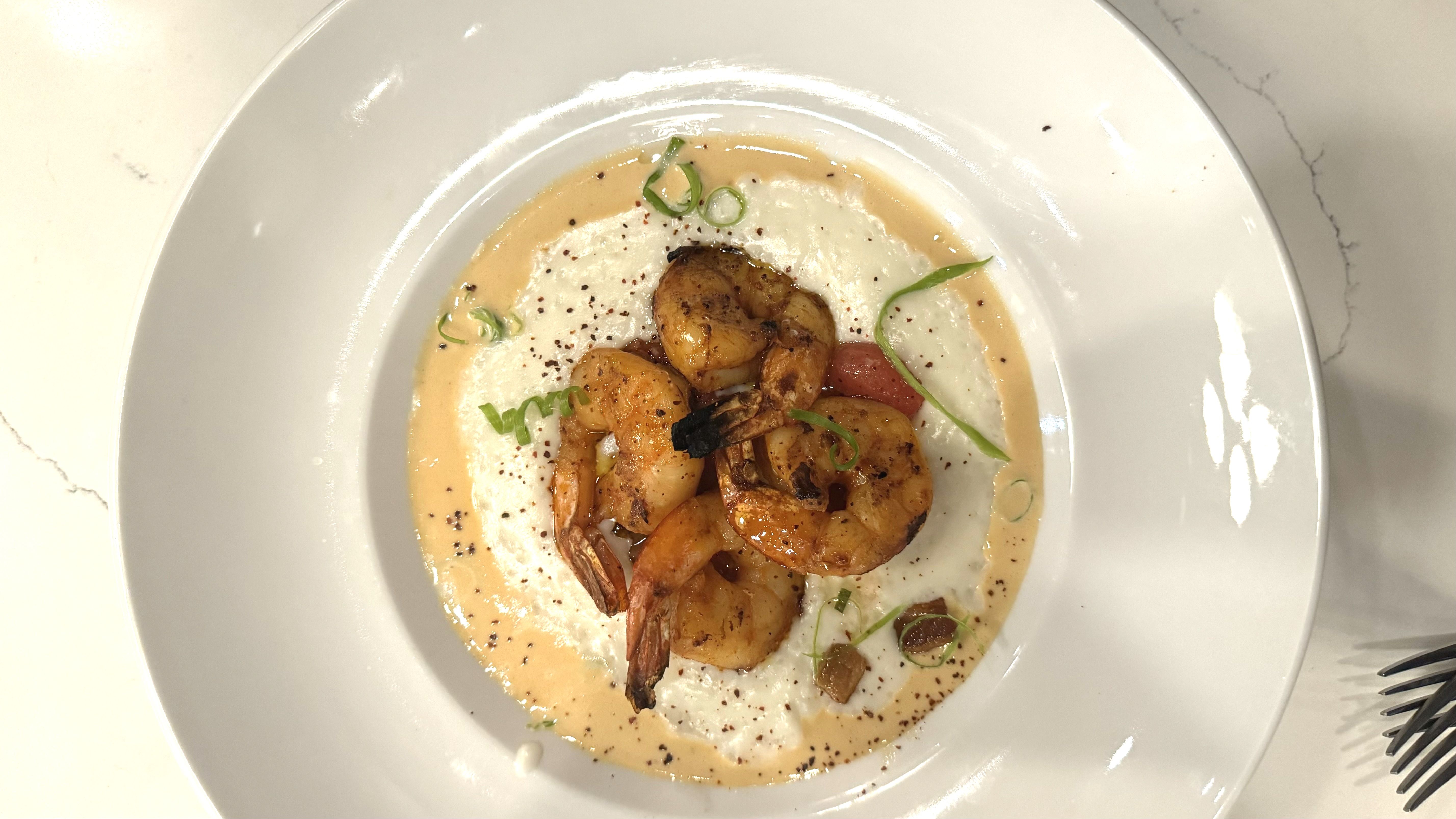 A bowl of shrimp and grits.