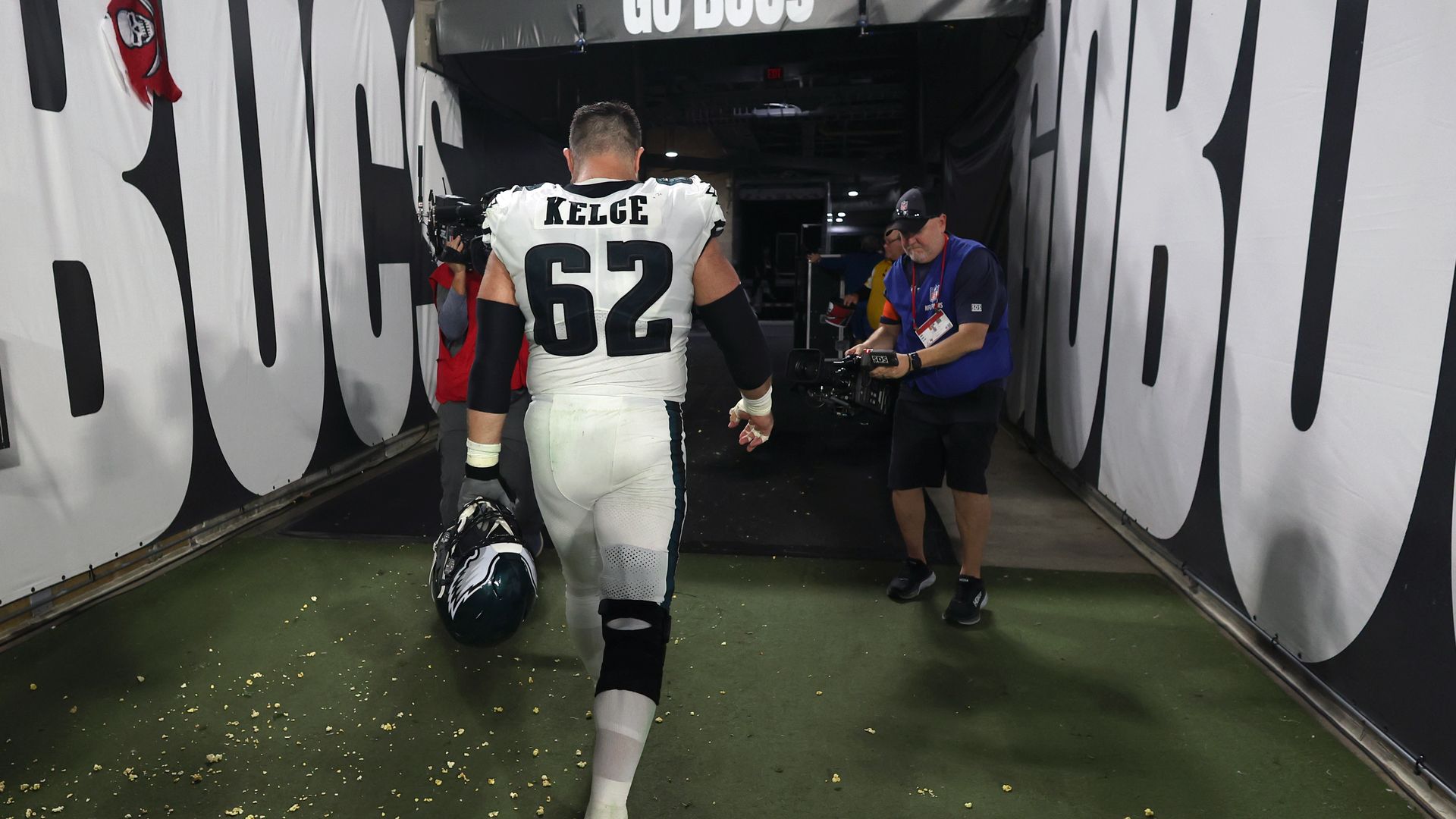 The Eagles' Jason Kelce walks off the field for the last time after a playoff loss to Tampa Bay.