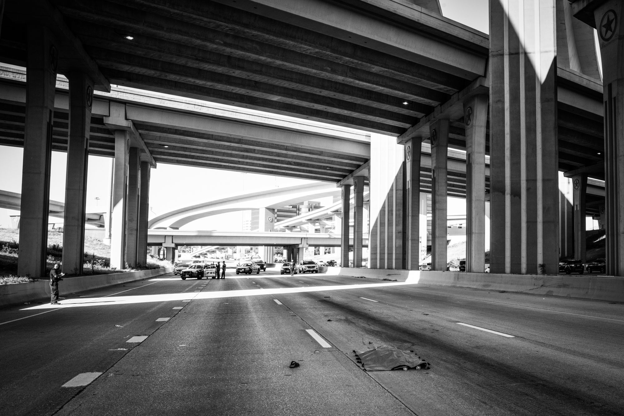 A body, covered, on a highway in Dallas