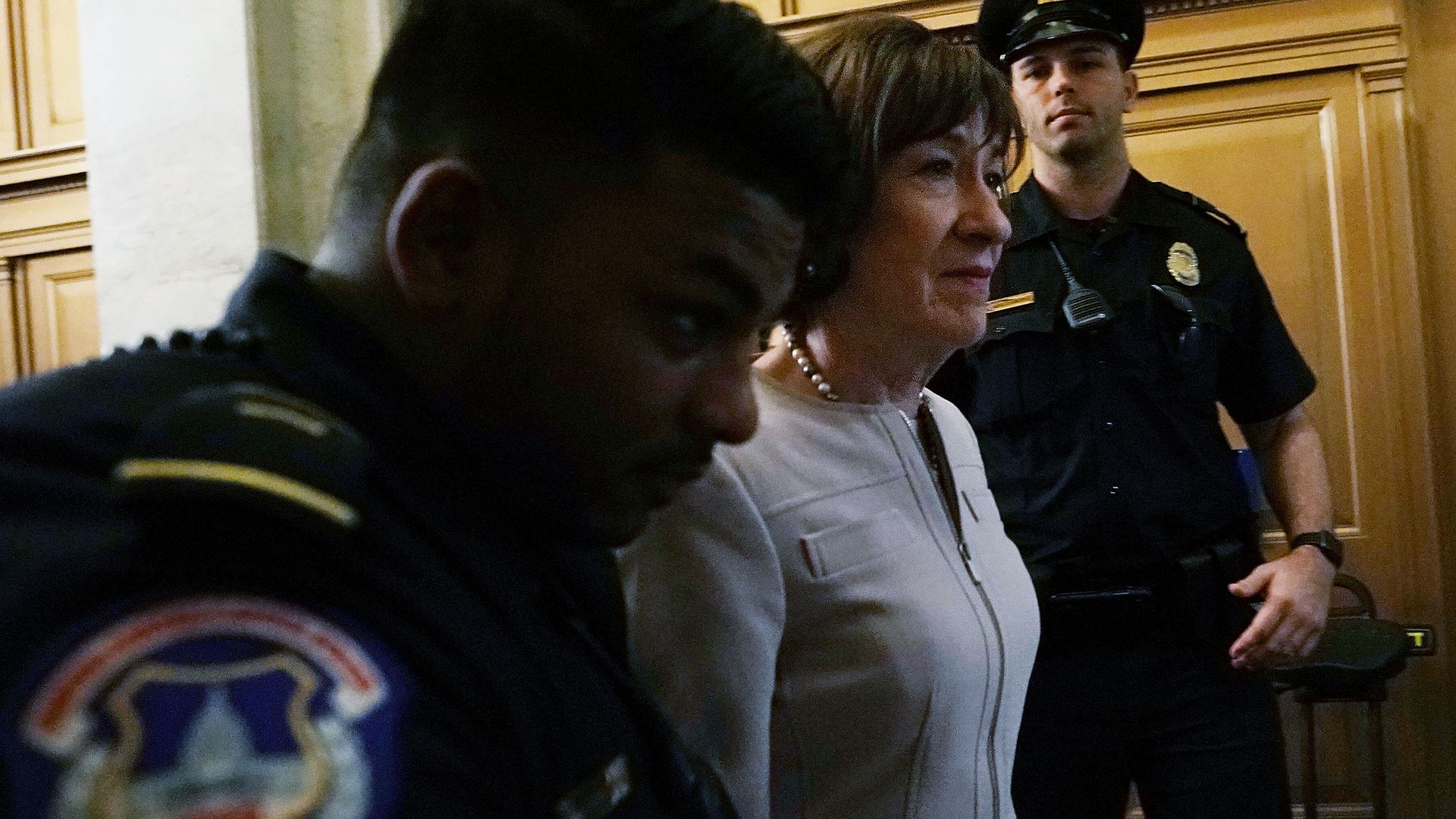 Susan Collins with police officers.
