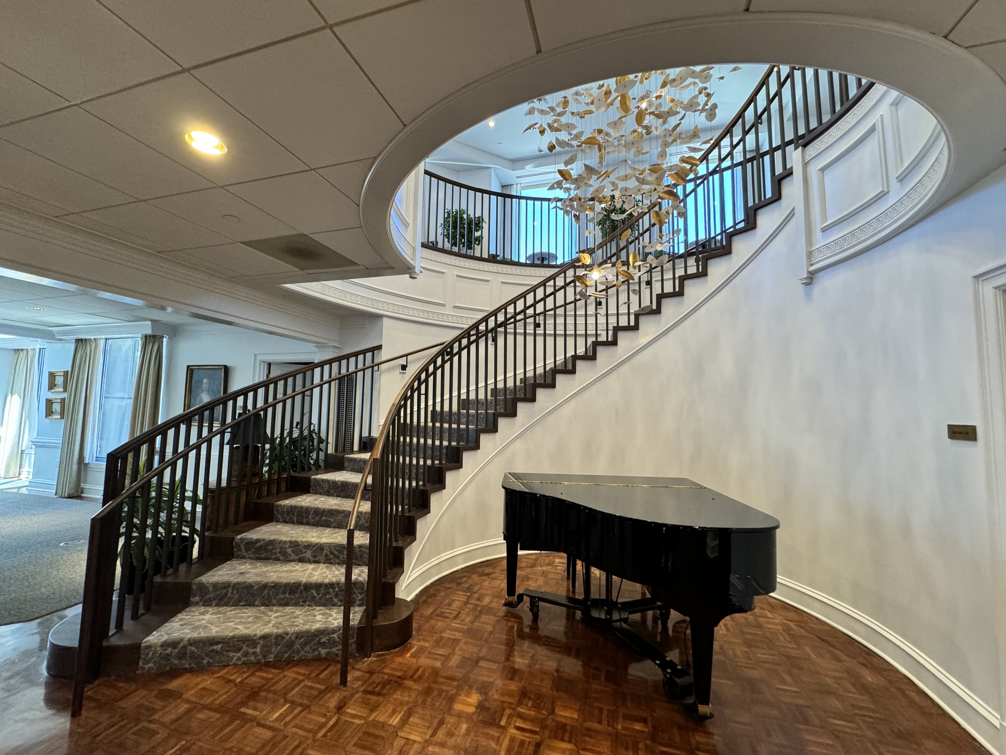 staircase with grand piano