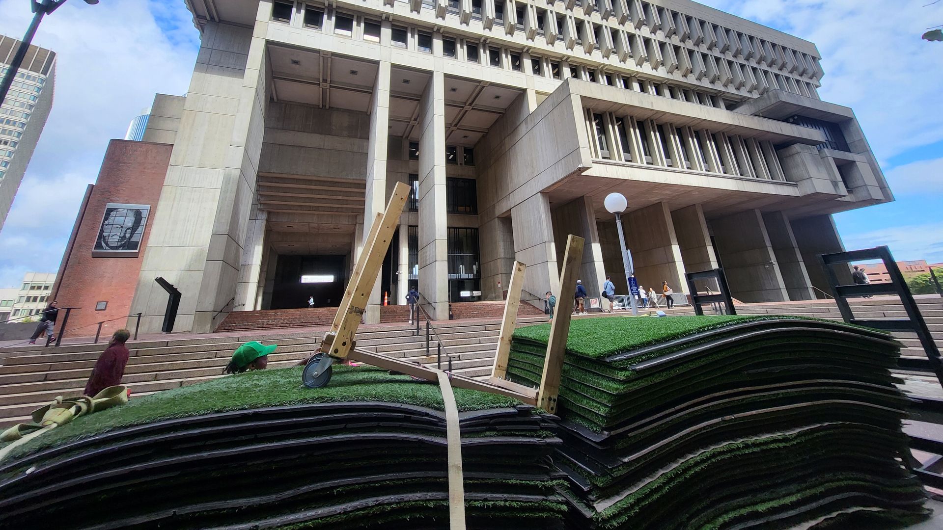 Boston City Hall with packed up green astroturf