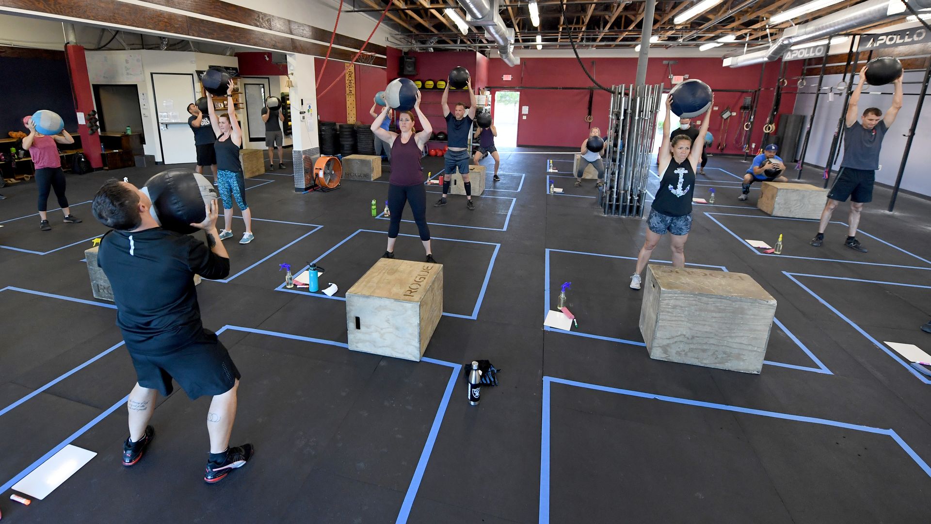 People work out in a CrossFit gym 