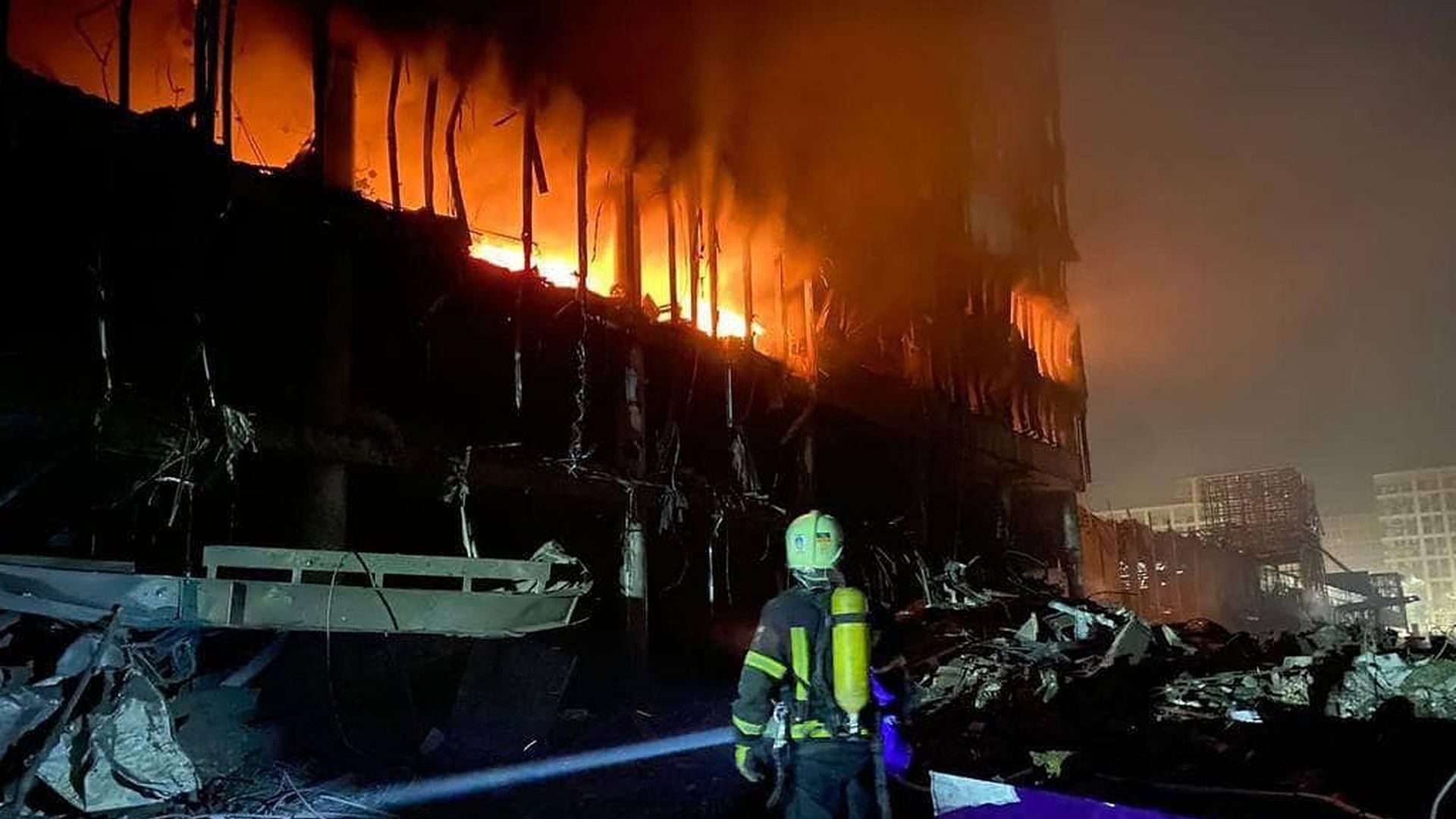 Firefighters extinguish fire broke out after a Russian shelling of a shopping mall in the Podilskyi district of Kyiv, Ukraine on March 21.