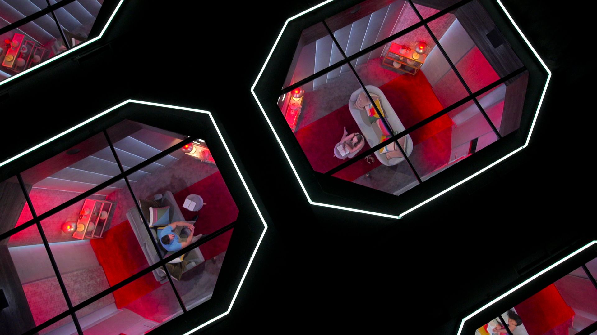 A man and woman talking who can't see each other in the "Love Is Blind" pods