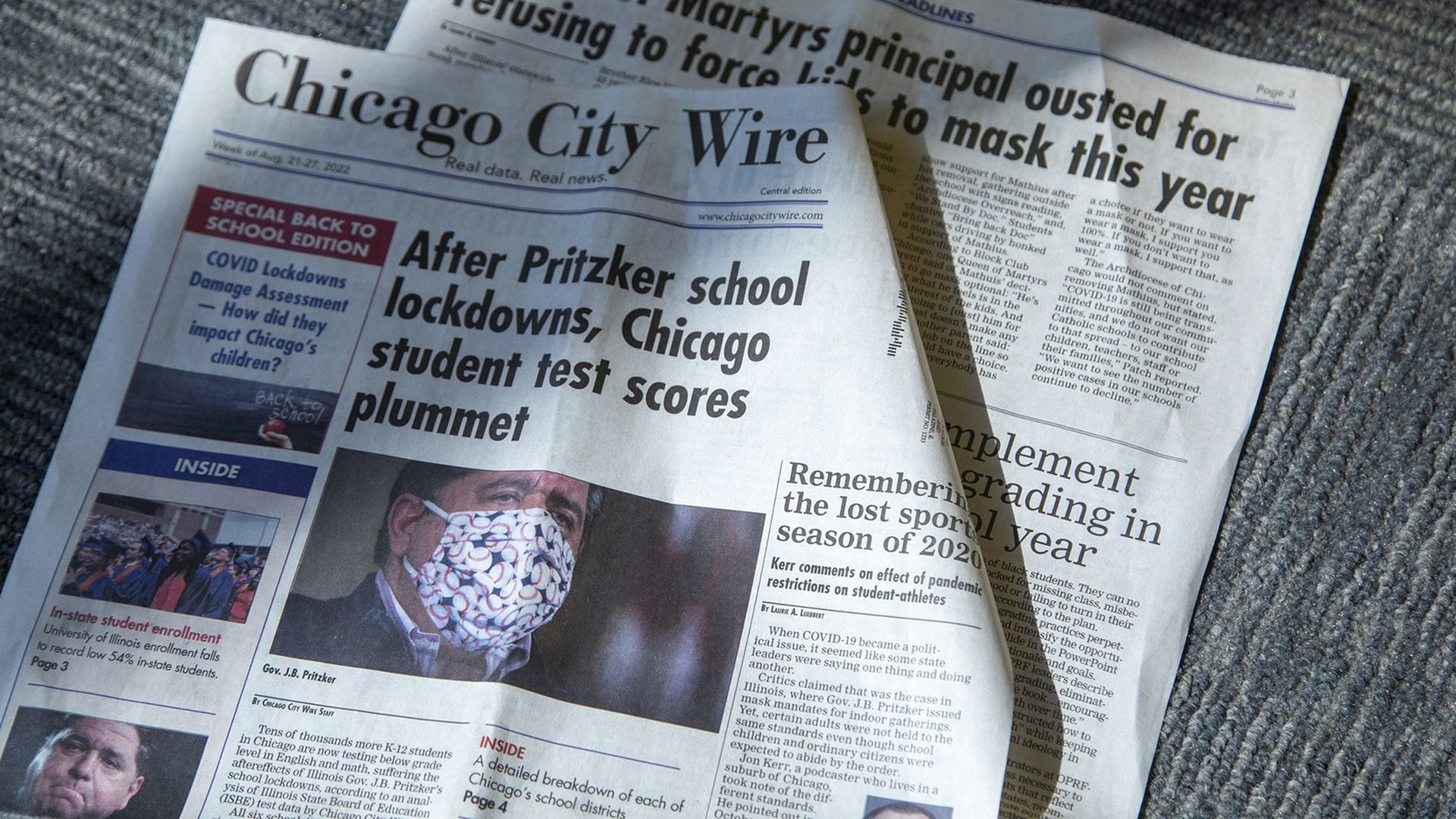 Photo of newspapers on a table. 