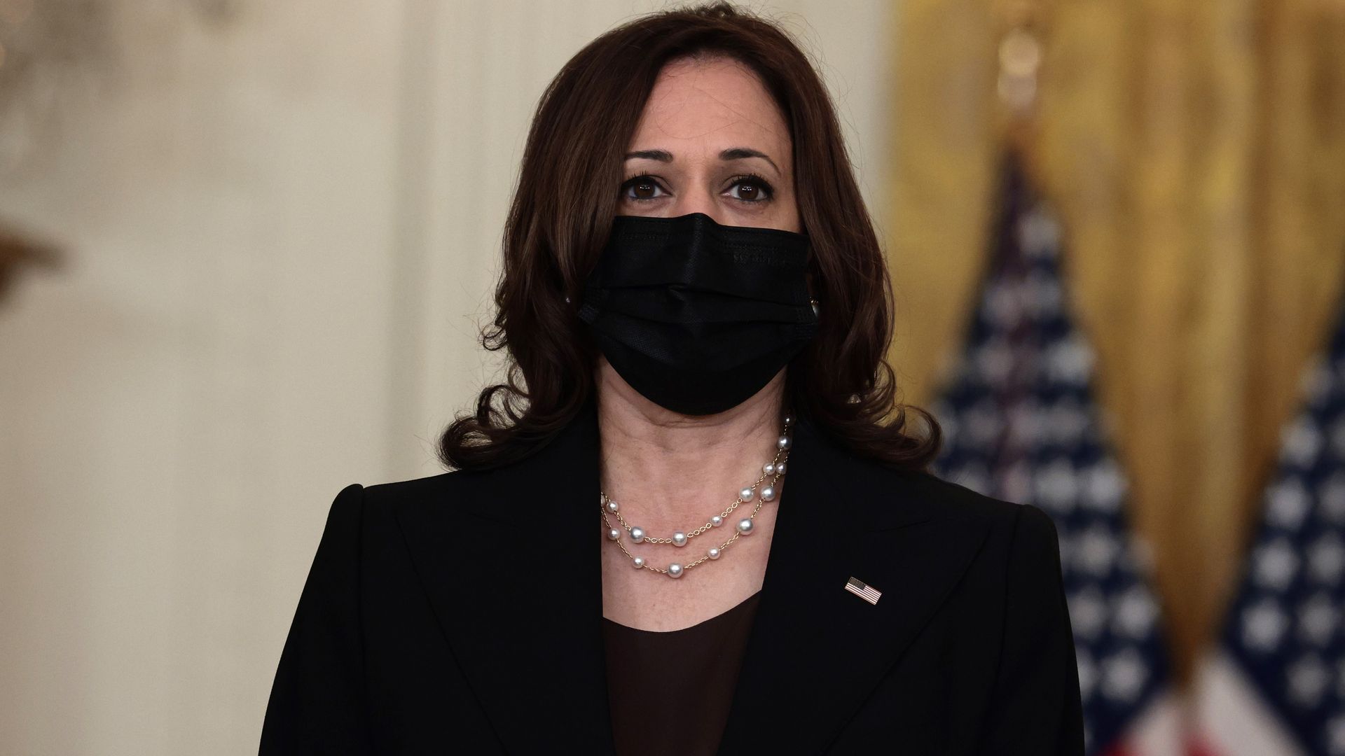 U.S. Vice President Kamala Harris listens as U.S. President Joe Biden gestures as delivers remarks on the U.S. military’s ongoing evacuation efforts in Afghanistan.