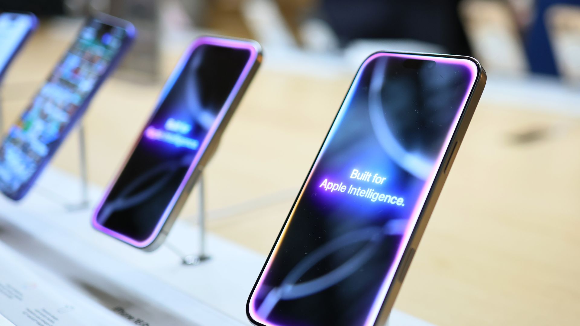 Apple iPhone 16 models on display inside an Apple store in New York.