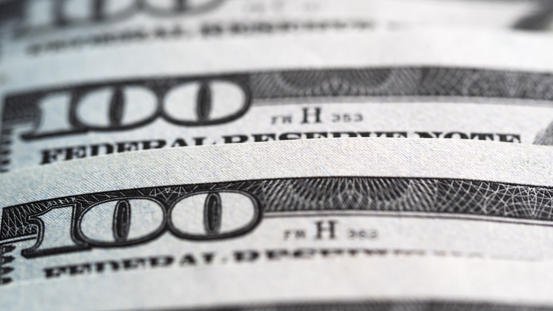 Photo of several $100 dollar bills