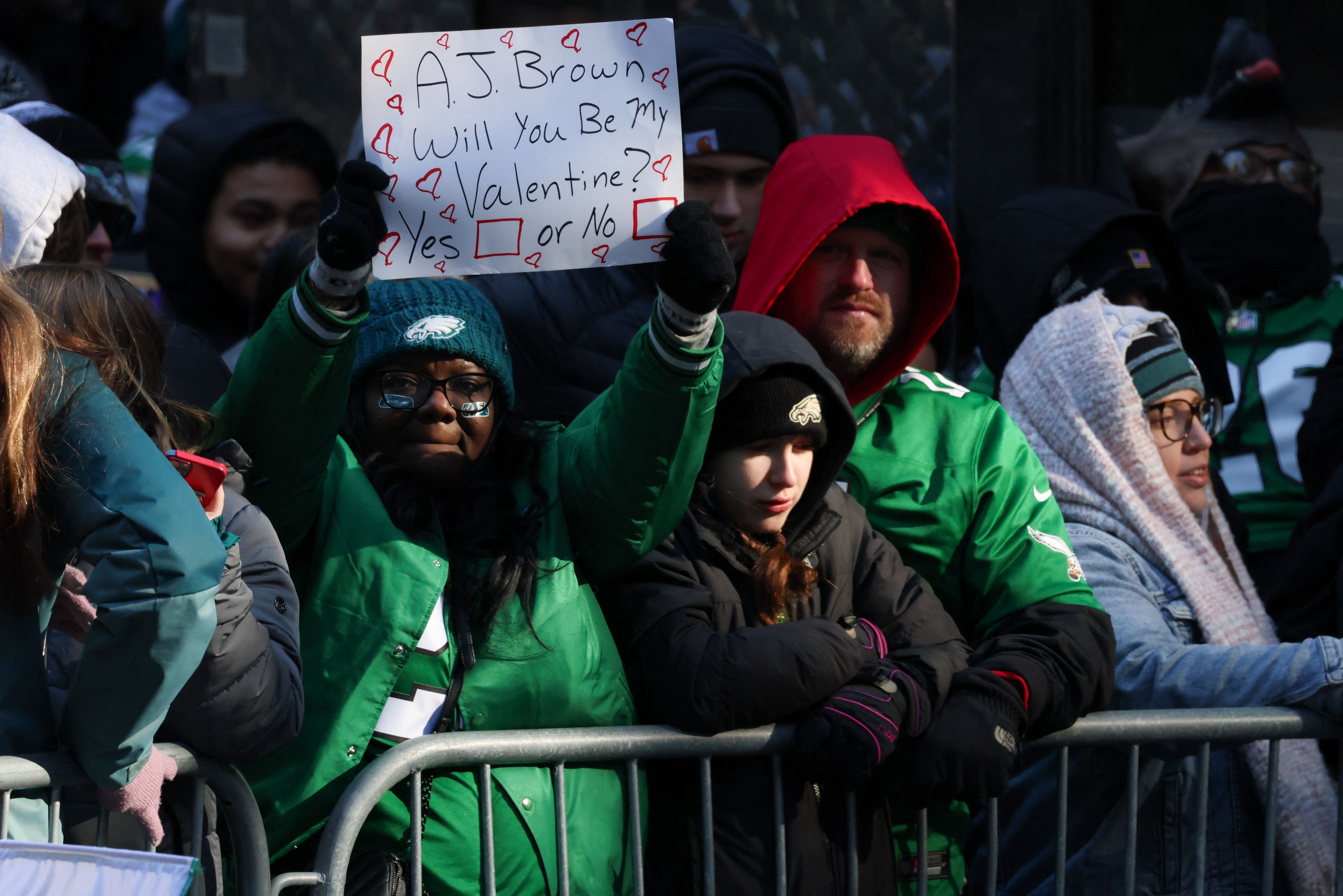 An Eagles fan holds up a sign for AJ Brown asking "Will you be my Valentine?"