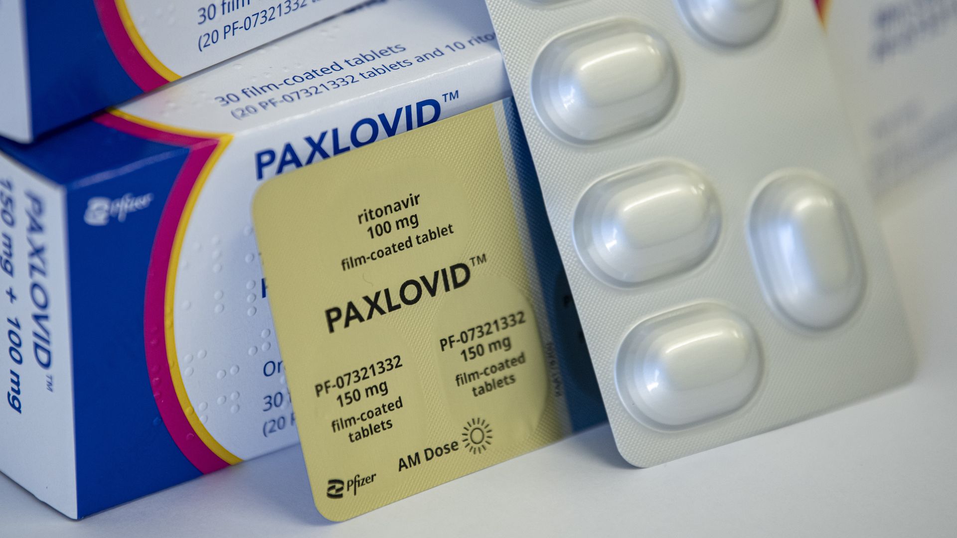 Boxes of Paxlovid lie on a table.
