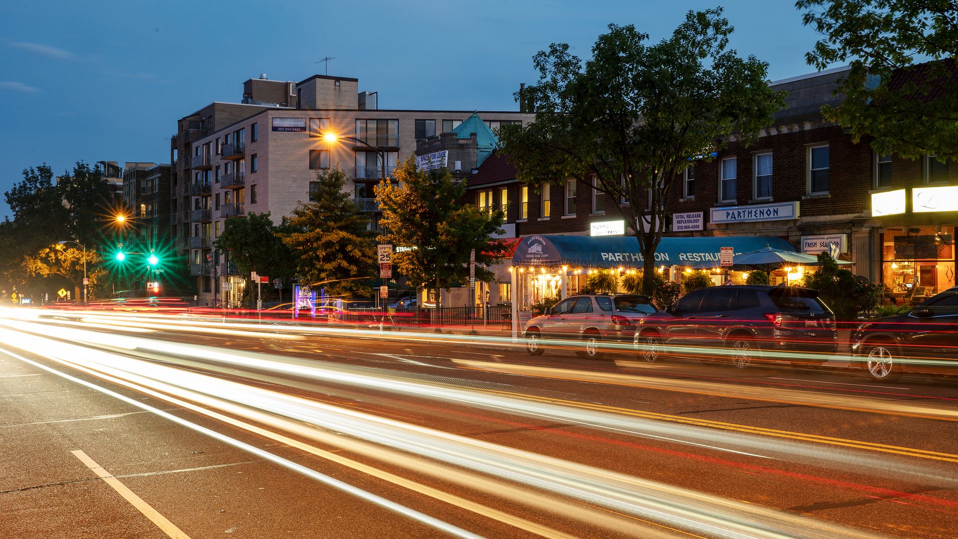 A nighttime long-exposure photograph of Connecticut Avenue traffic