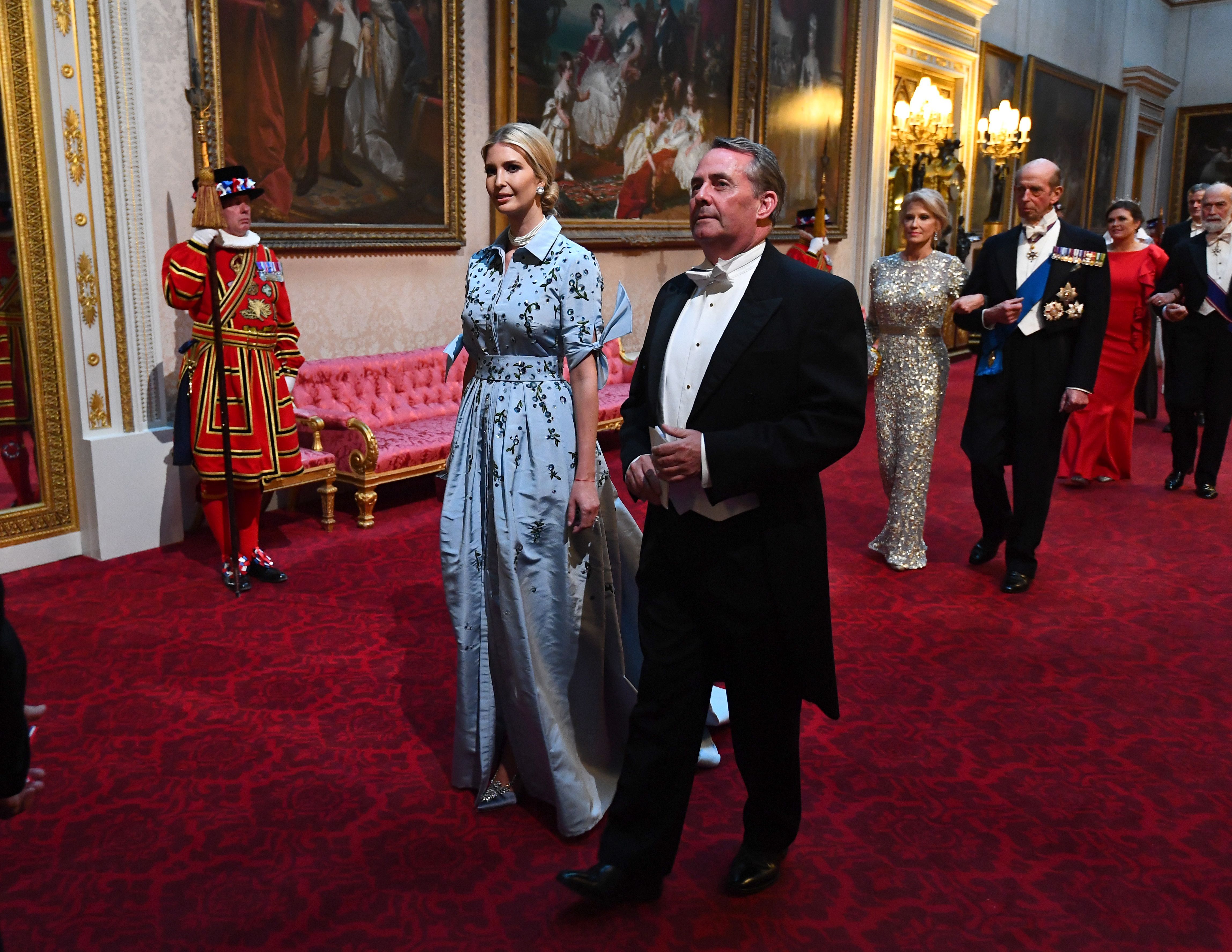 Ivanka Trump and Britain's International Trade Secretary Liam Fox arrive through the East Gallery during a State Banquet in the ballroom at Buckingham Palace in central London on June 3.