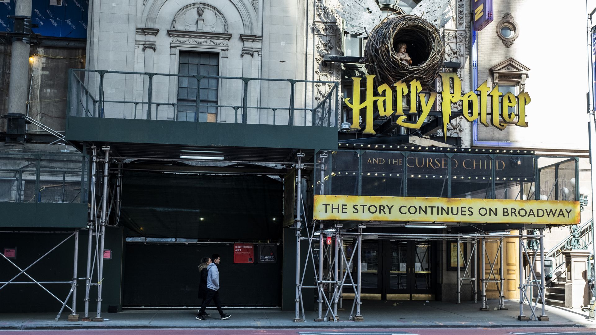  A man walks past the Lyric Theatre where Harry Potter and the Cursed Child