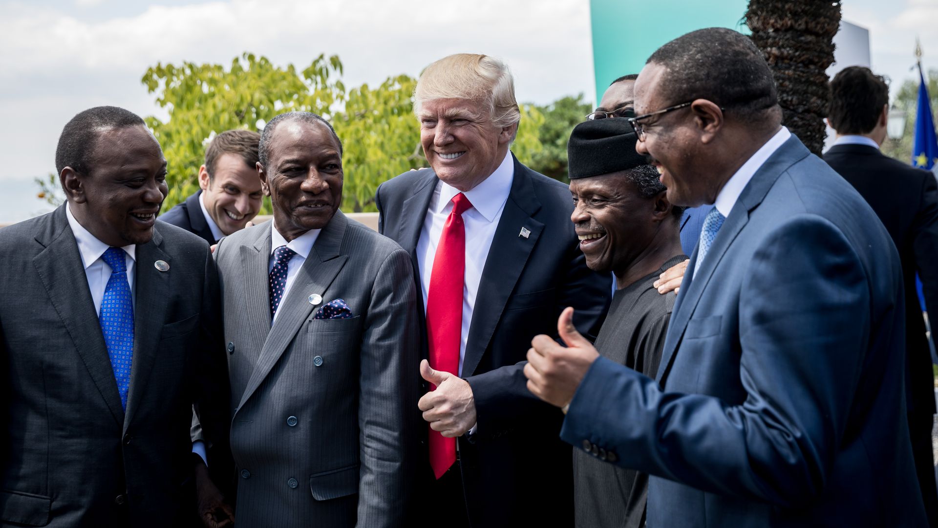 US President Donald Trump standing with Uhuru Kenyatt, Mahamadou Issoufou, Muhammadu Buhari and President of the African Development Bank.