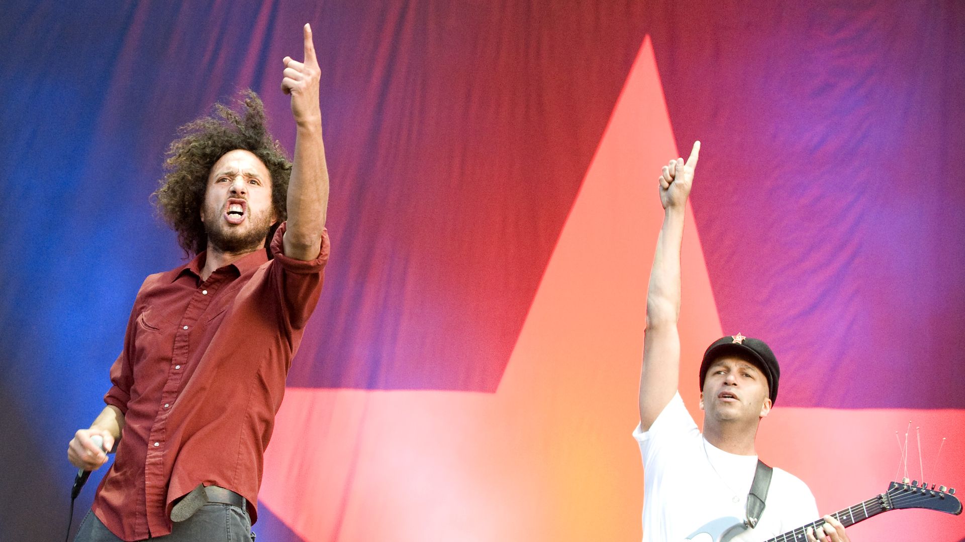 Zack de la Rocha and Tom Morello of Rage Against the Machine perform on stage.