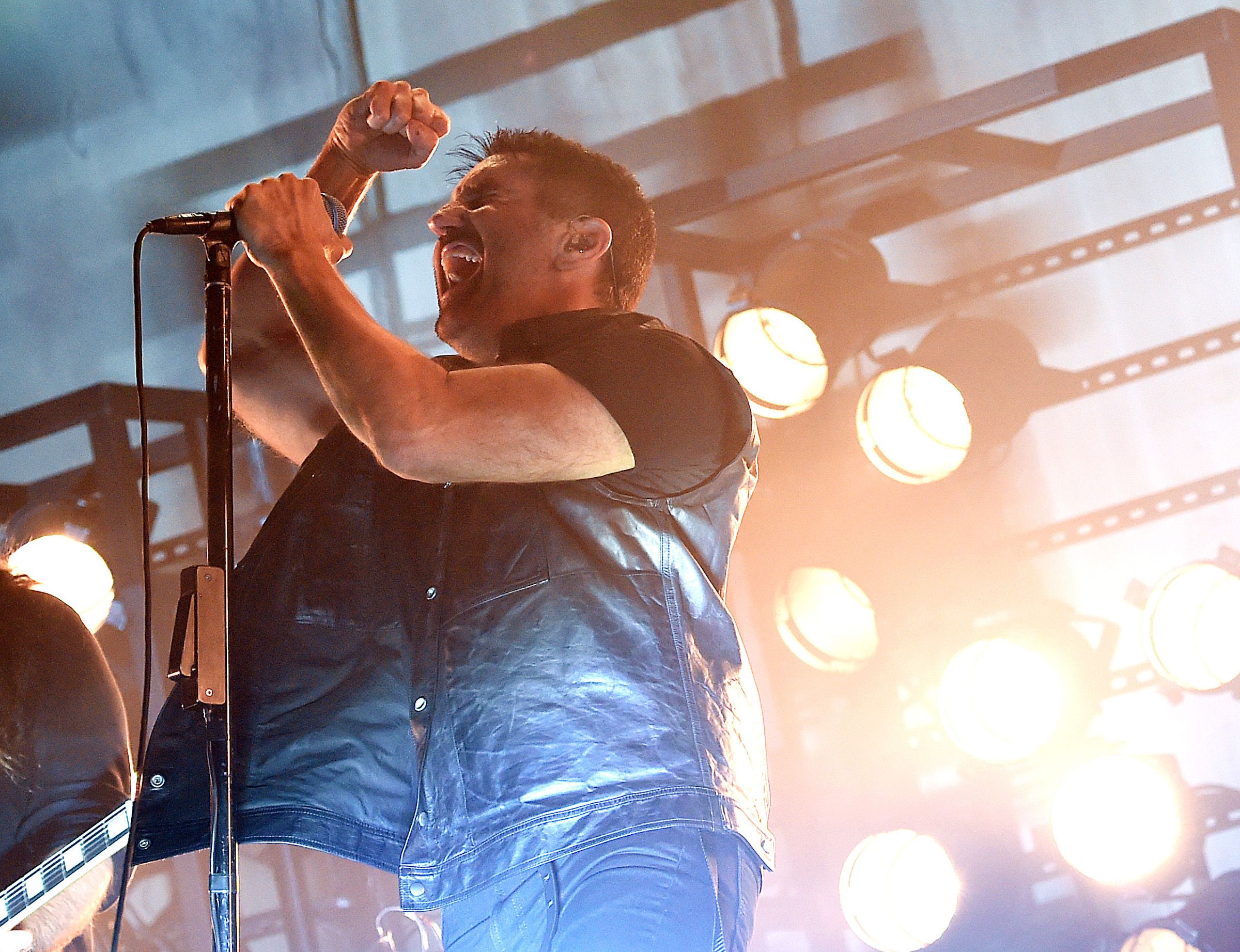 Trent Reznor of Nine Inch Nails performs on stage. 