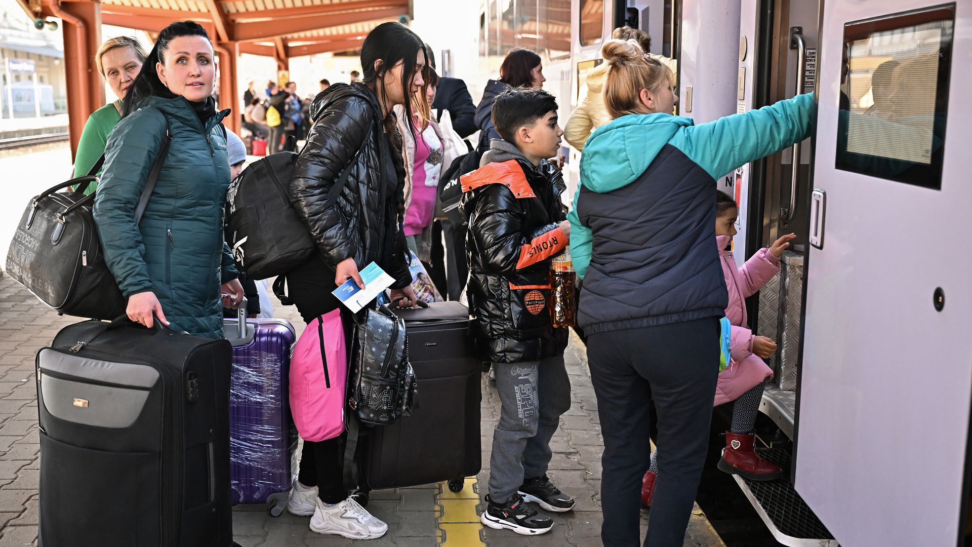 Picture of women and children boarding a train