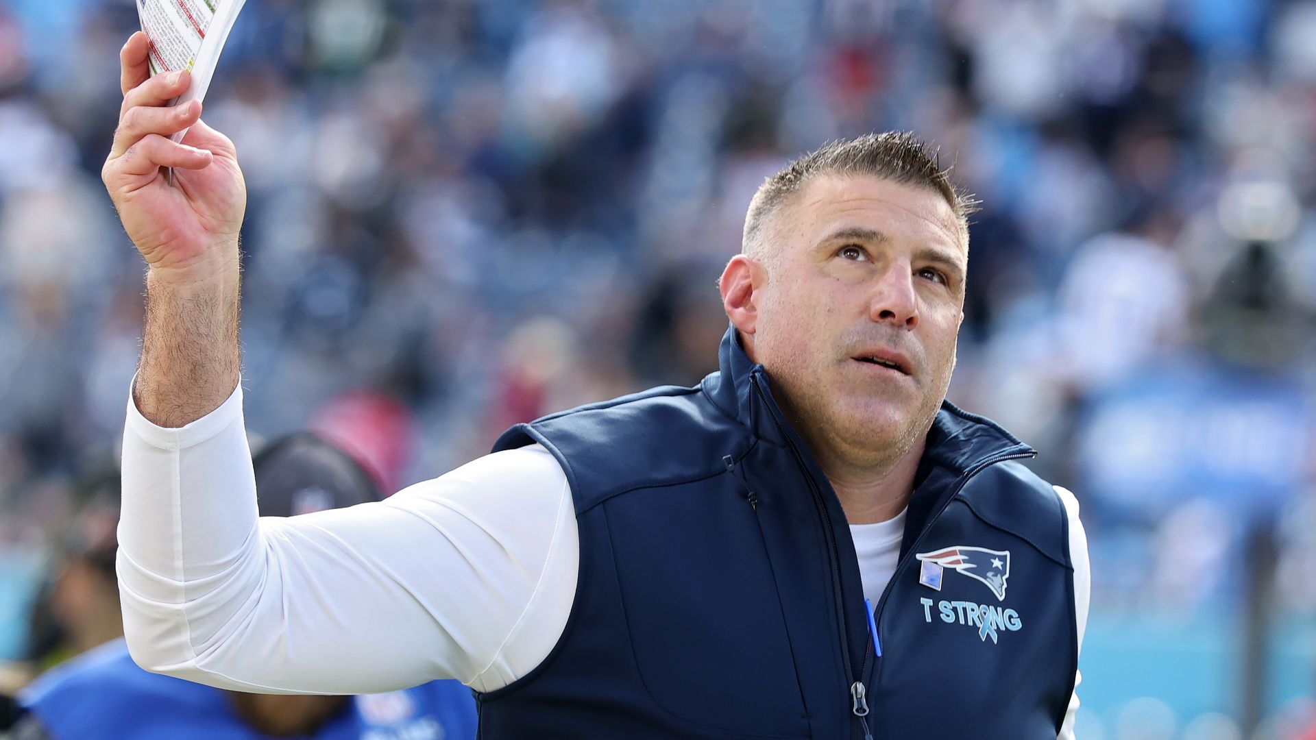 Head coach Mike Vrabel of the New England Patriots runs off the field after defeating the Tennessee Titans at Nissan Stadium