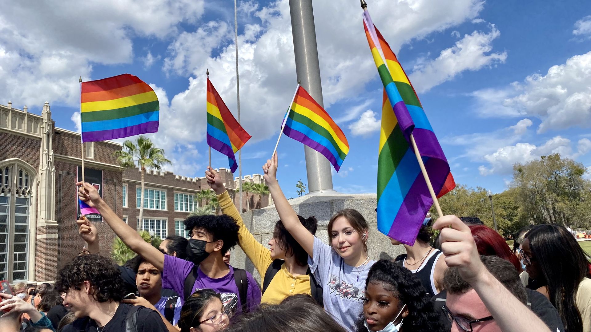 Hillsborough High School students wave rainbow flags.
