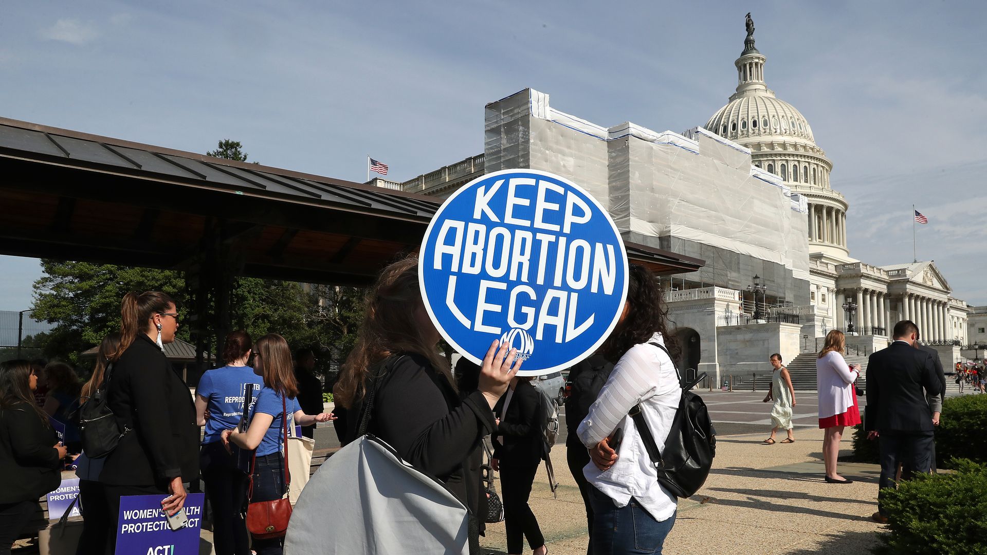 A protestor holds a sign that reads "keep abortion legal" outside the Supreme Court.