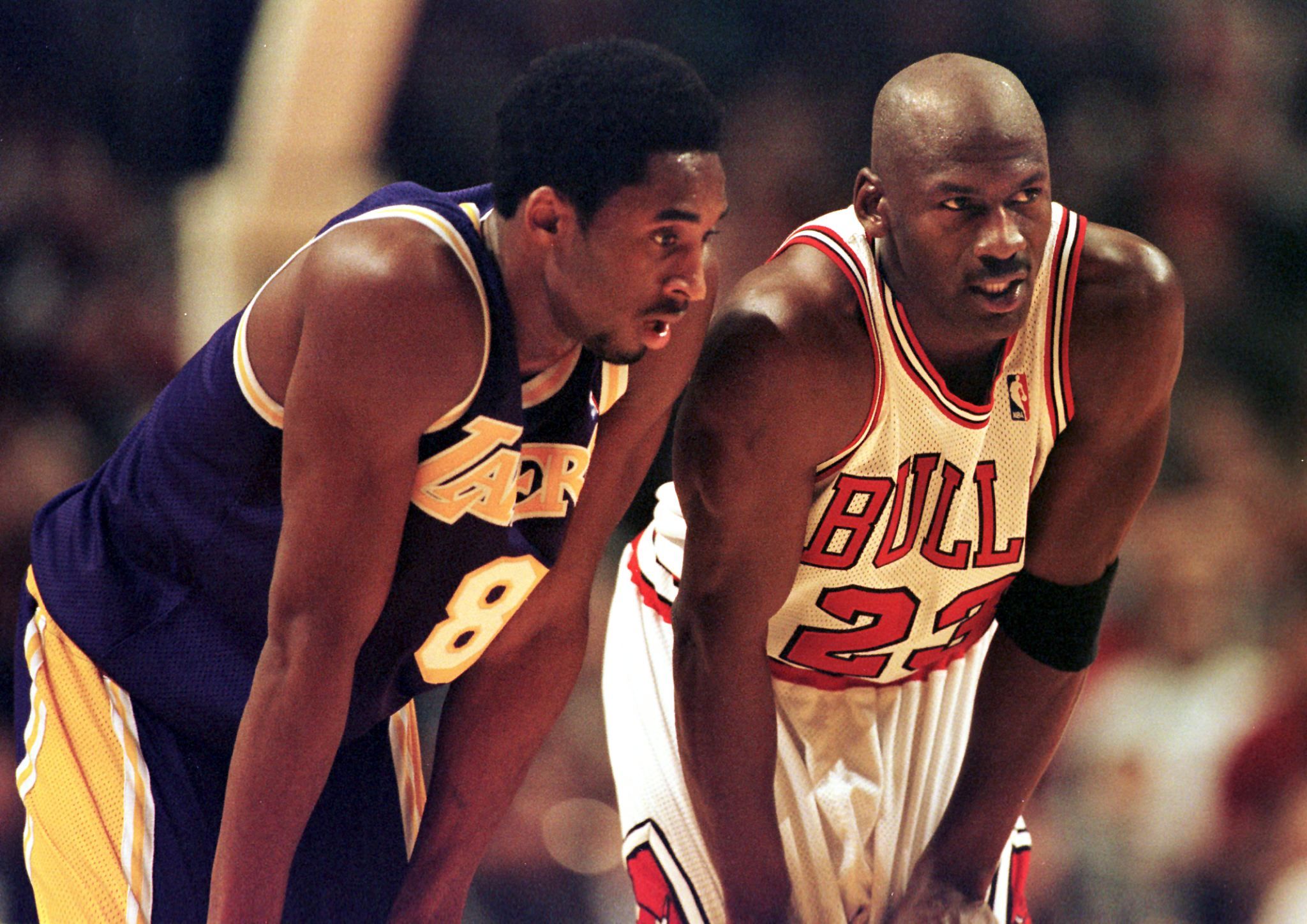 Los Angeles Lakers guard Kobe Bryant(L) and Chicago Bulls guard Michael Jordan(R) talk during a free-throw attempt during the fourth quarter 17 December at the United Center in Chicago. 