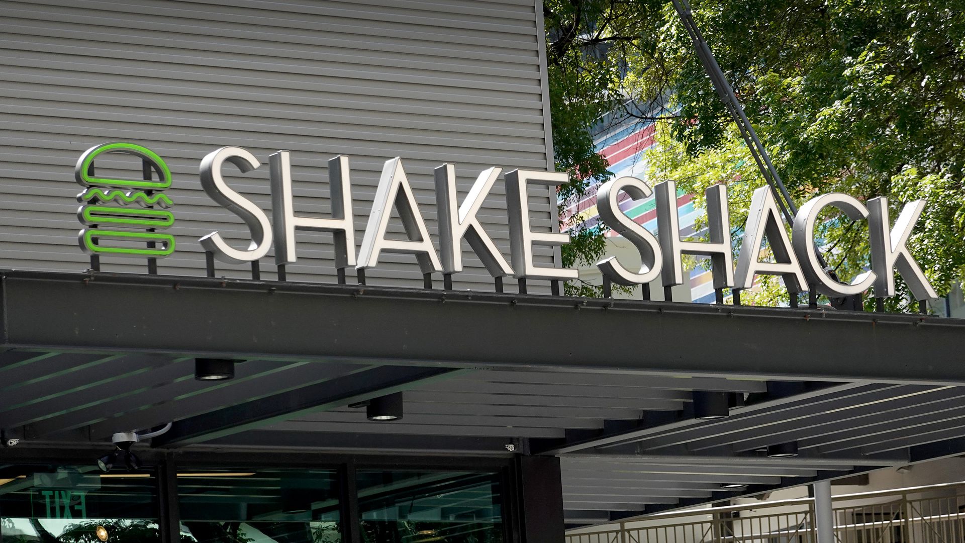 Shake Shack logo on top of a store