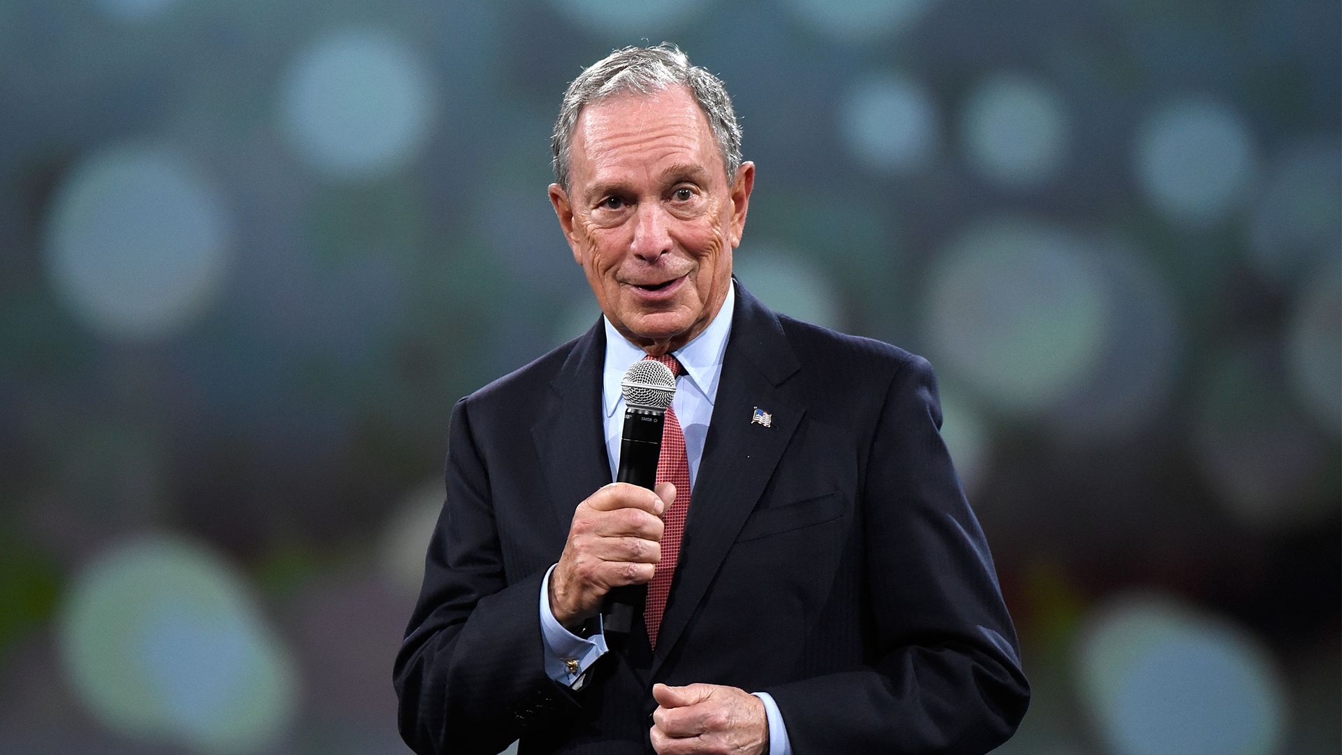 Michael Bloomberg with a mic in his hand