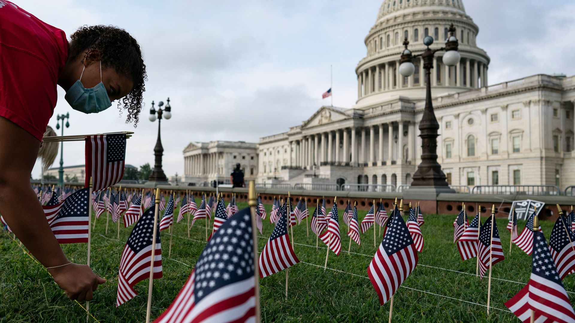 Photo of American flags on the lawn in front of the capitol building on Sept. 11.