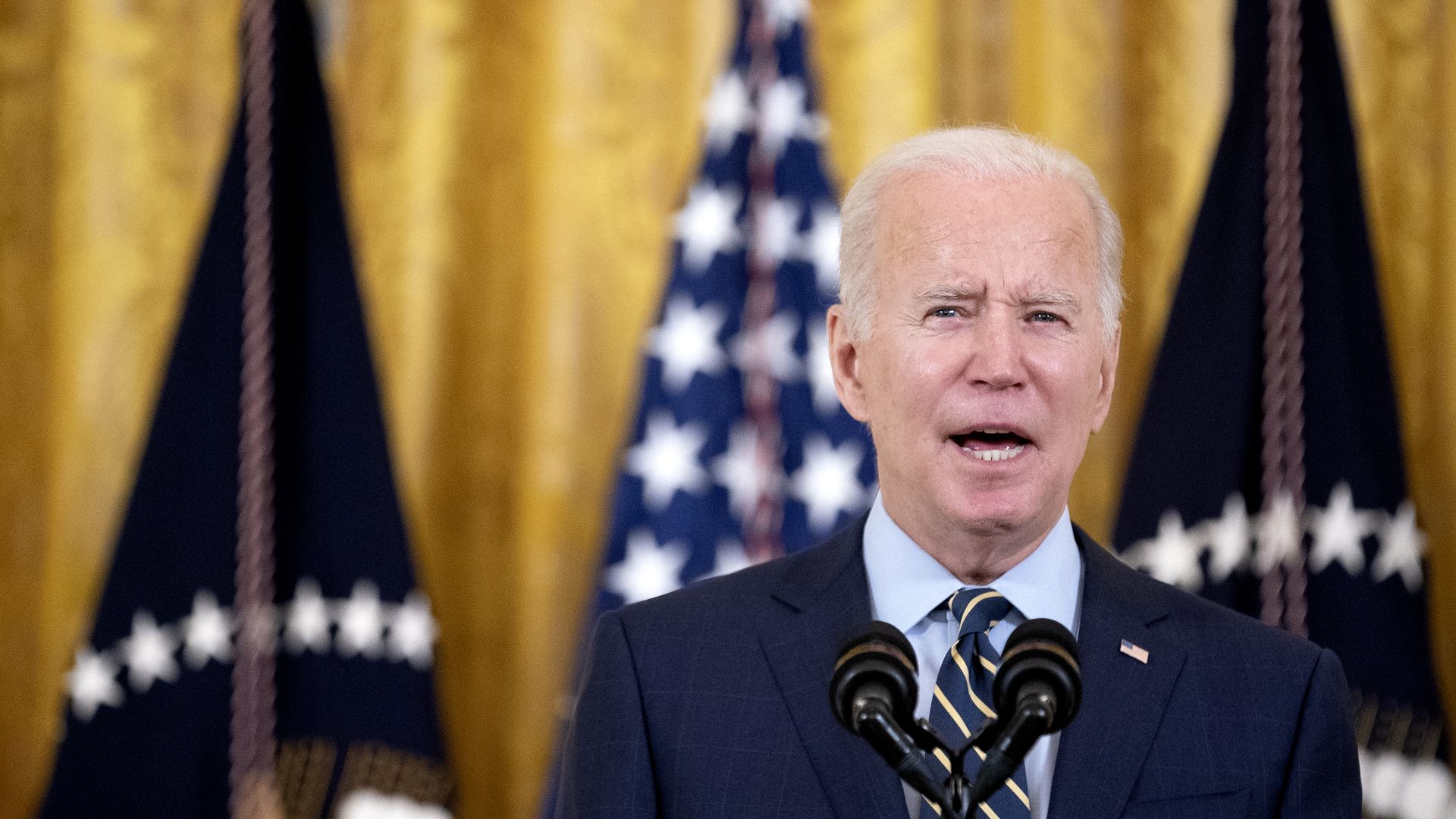 President Biden is seen speaking at the White House.