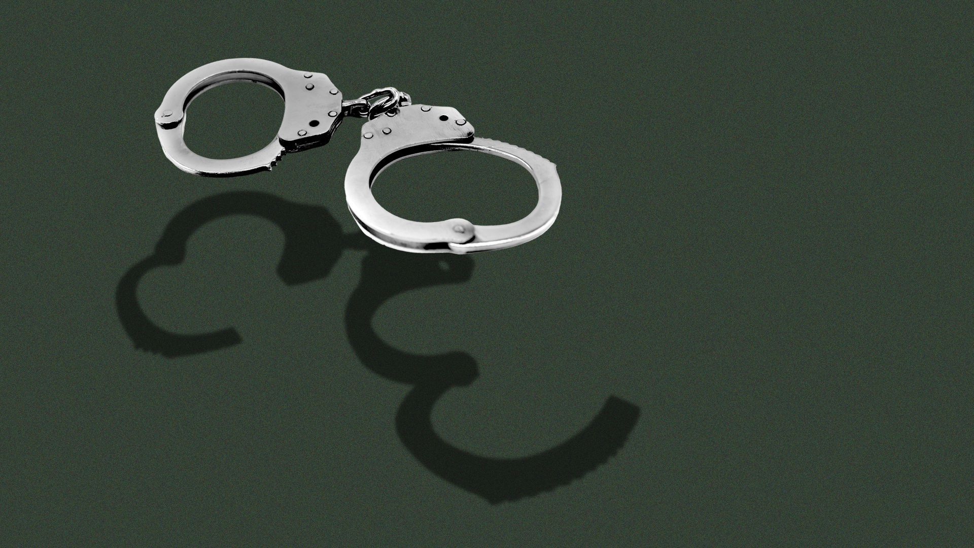 Illustration of a pair of closed handcuffs, over the handcuffs's shadow, which shows them open.