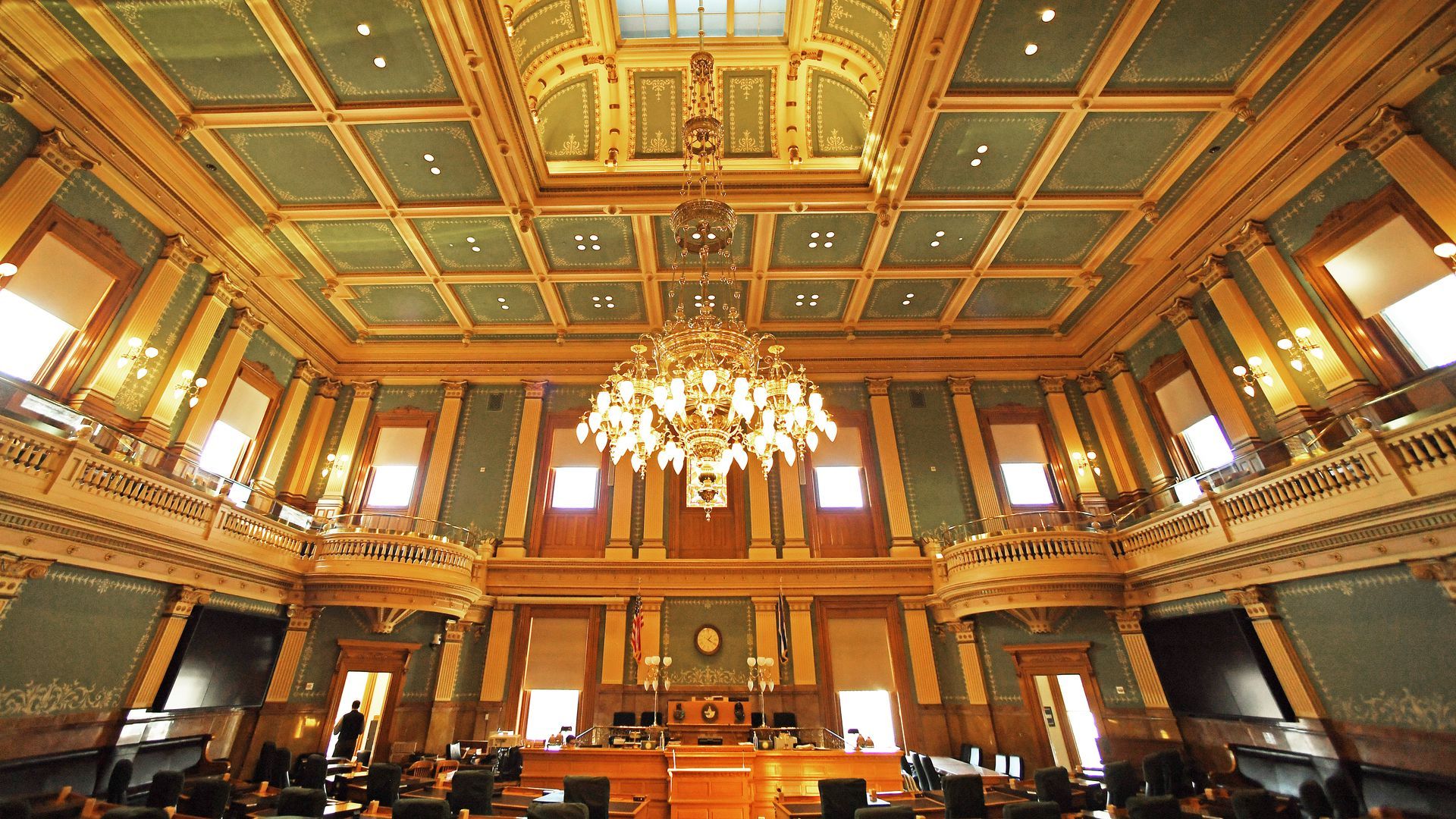 A grand room with a chandelier inside the Colorado state capitol building