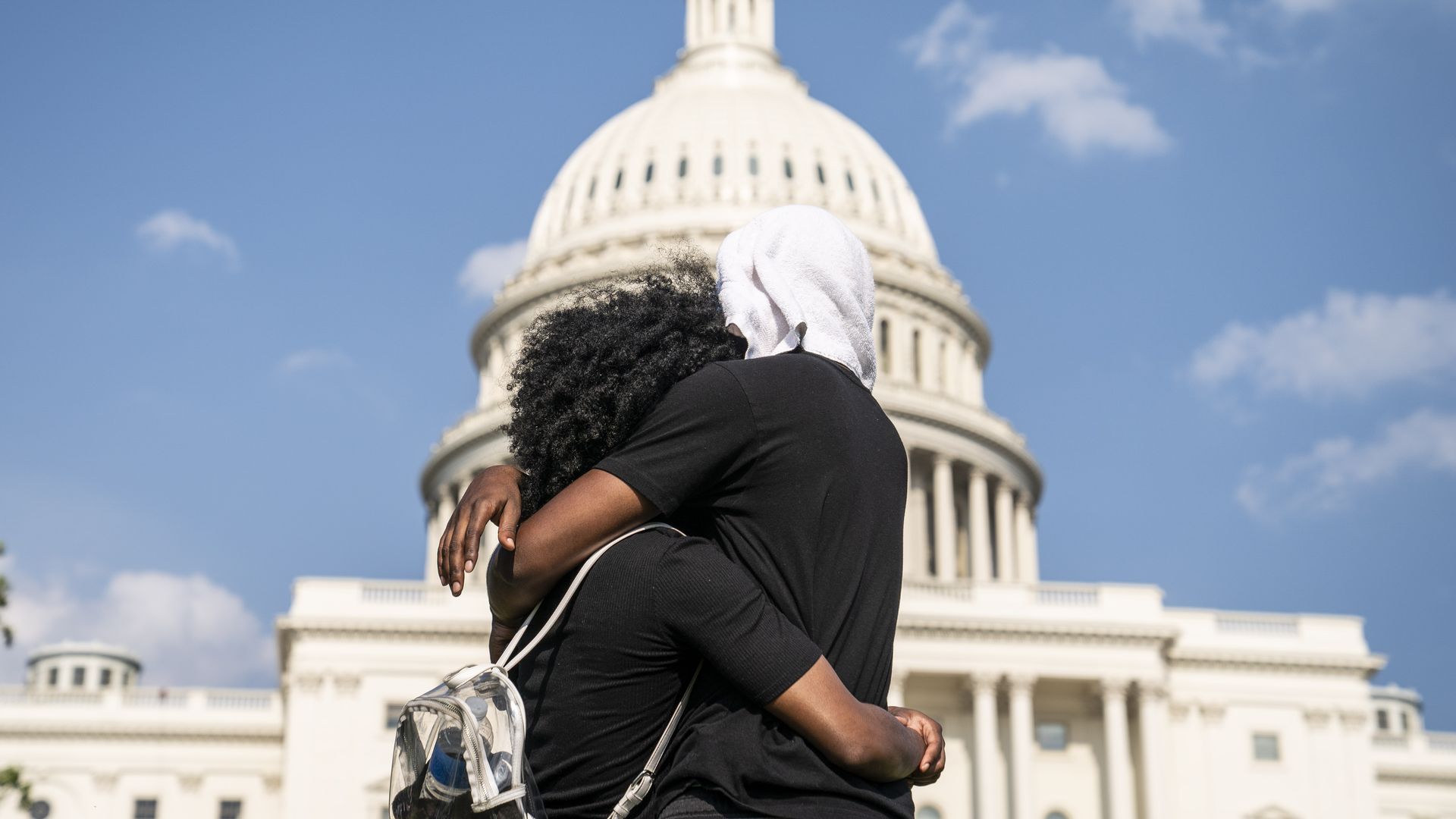 Protestors in front of the Capitol building. Photo: Sarah Silbiger/Getty Images