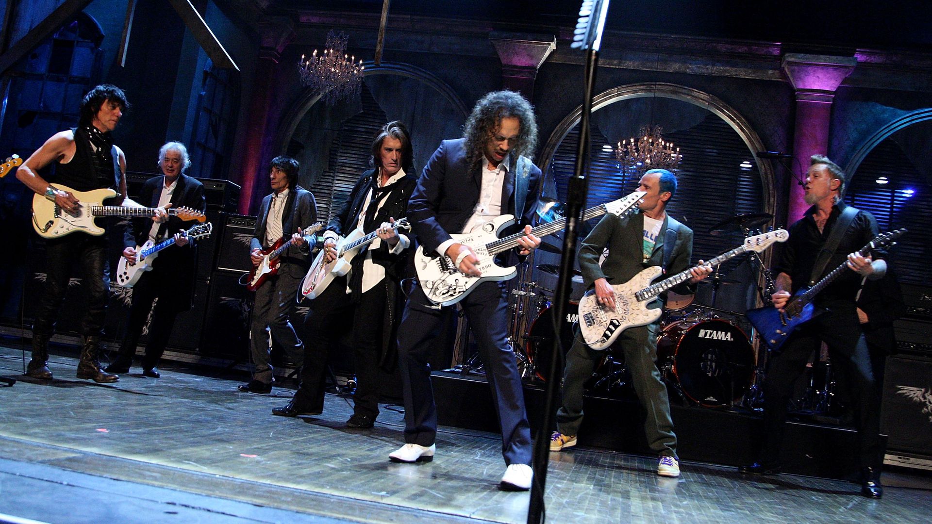 Jeff Beck, Jimmy Page, Ron Wood, Joe Perry, Kirk Hammett, Flea and James Hetfield perform onstage.