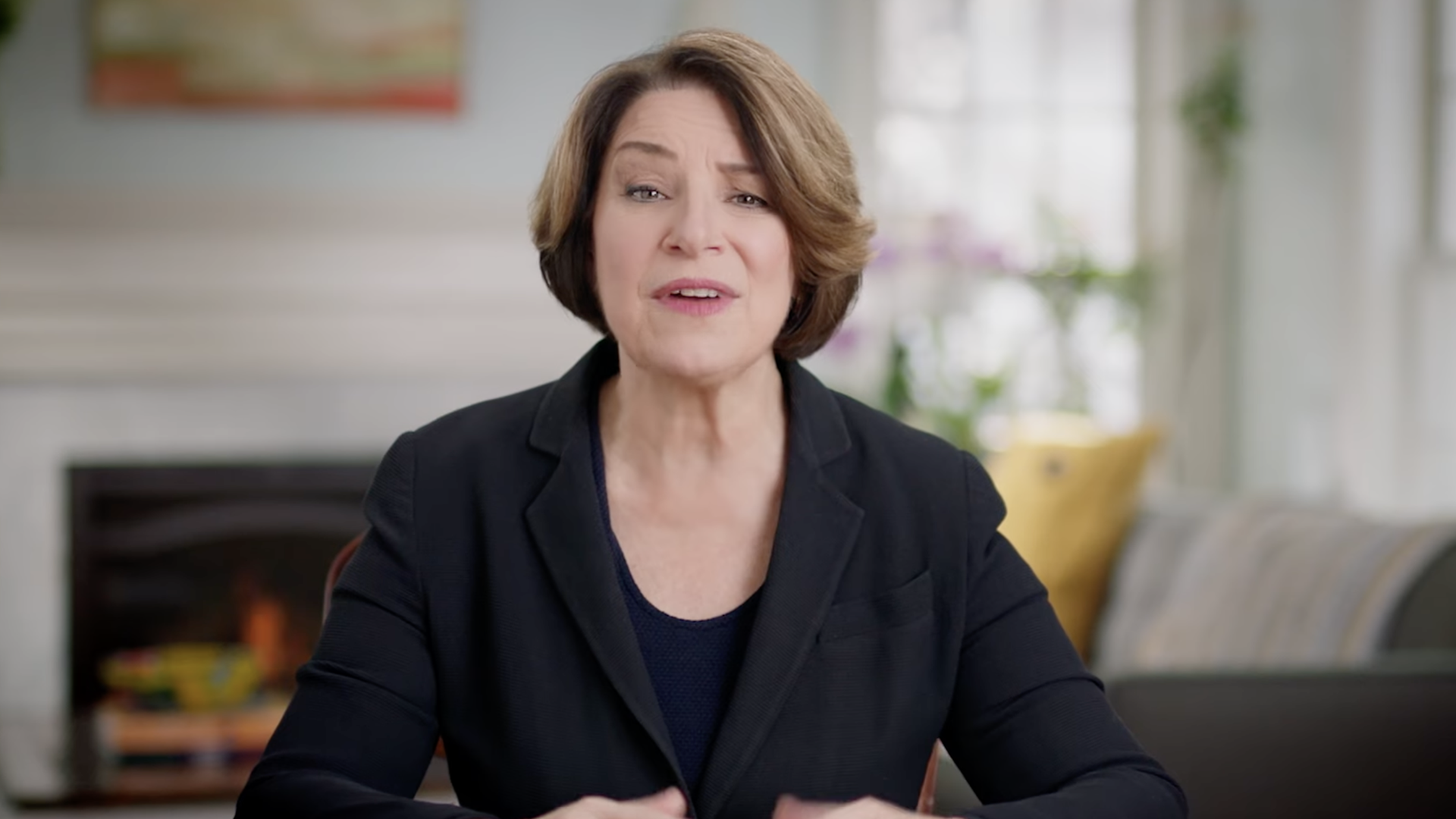Amy Klobuchar speaking in what looks like a living room