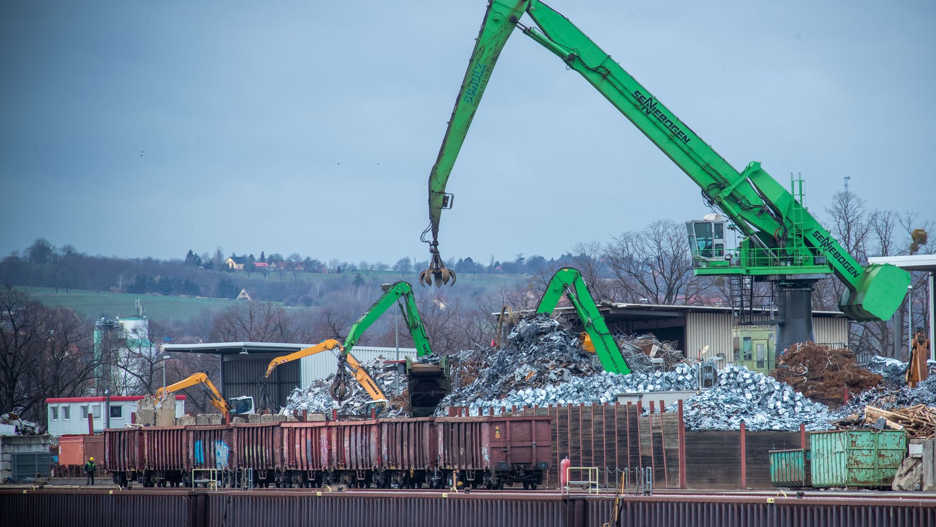 Cranes load freight cars with scrap metal in Dresden, Germany.