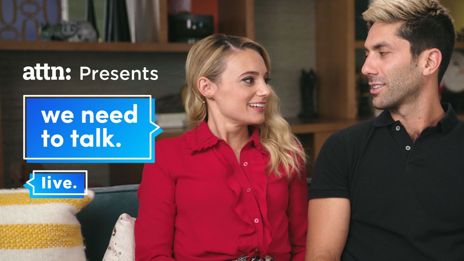 Two celebrities looking at one another.