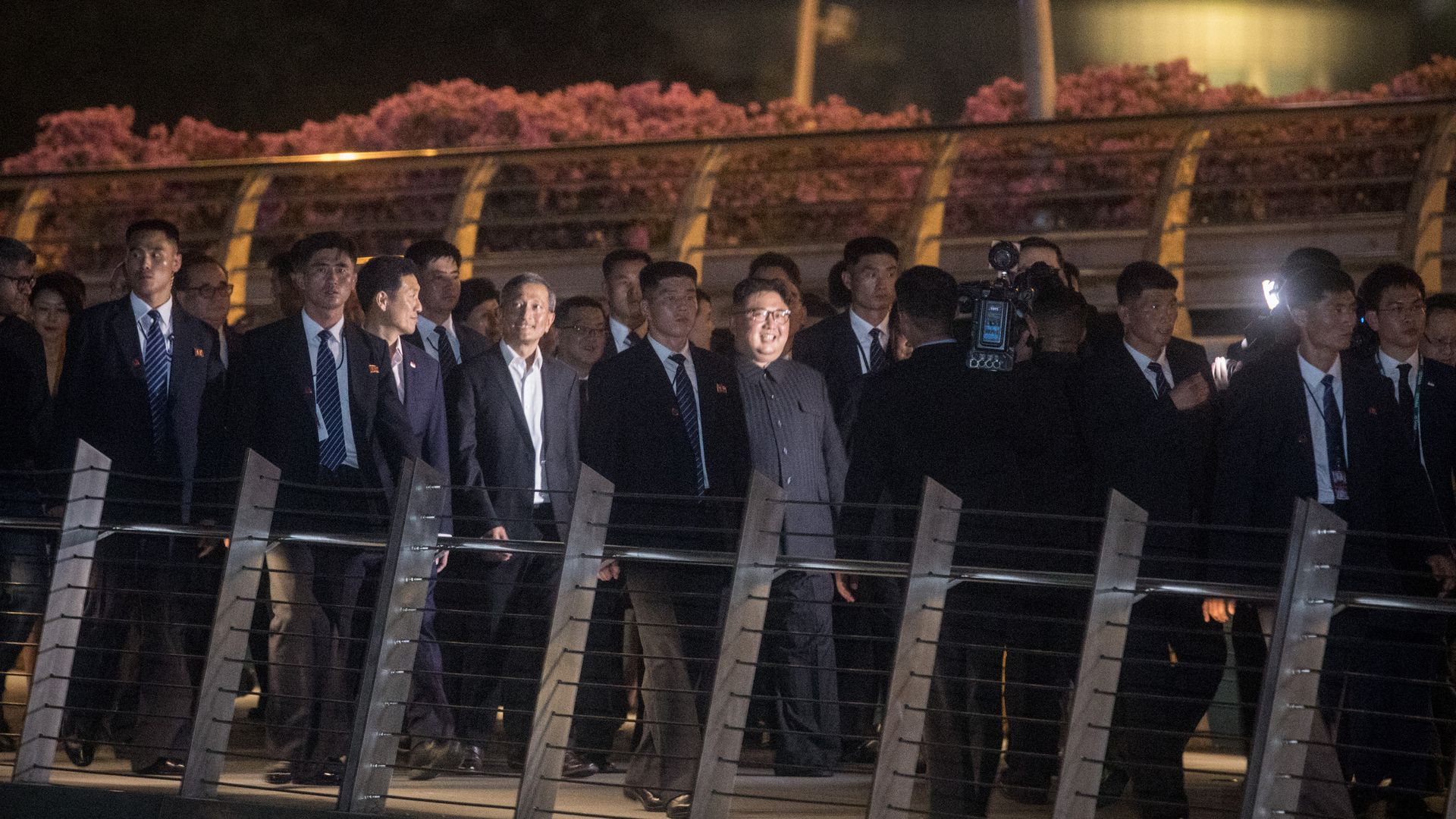 North Korean leader Kim Jong-un walking with bodyguards