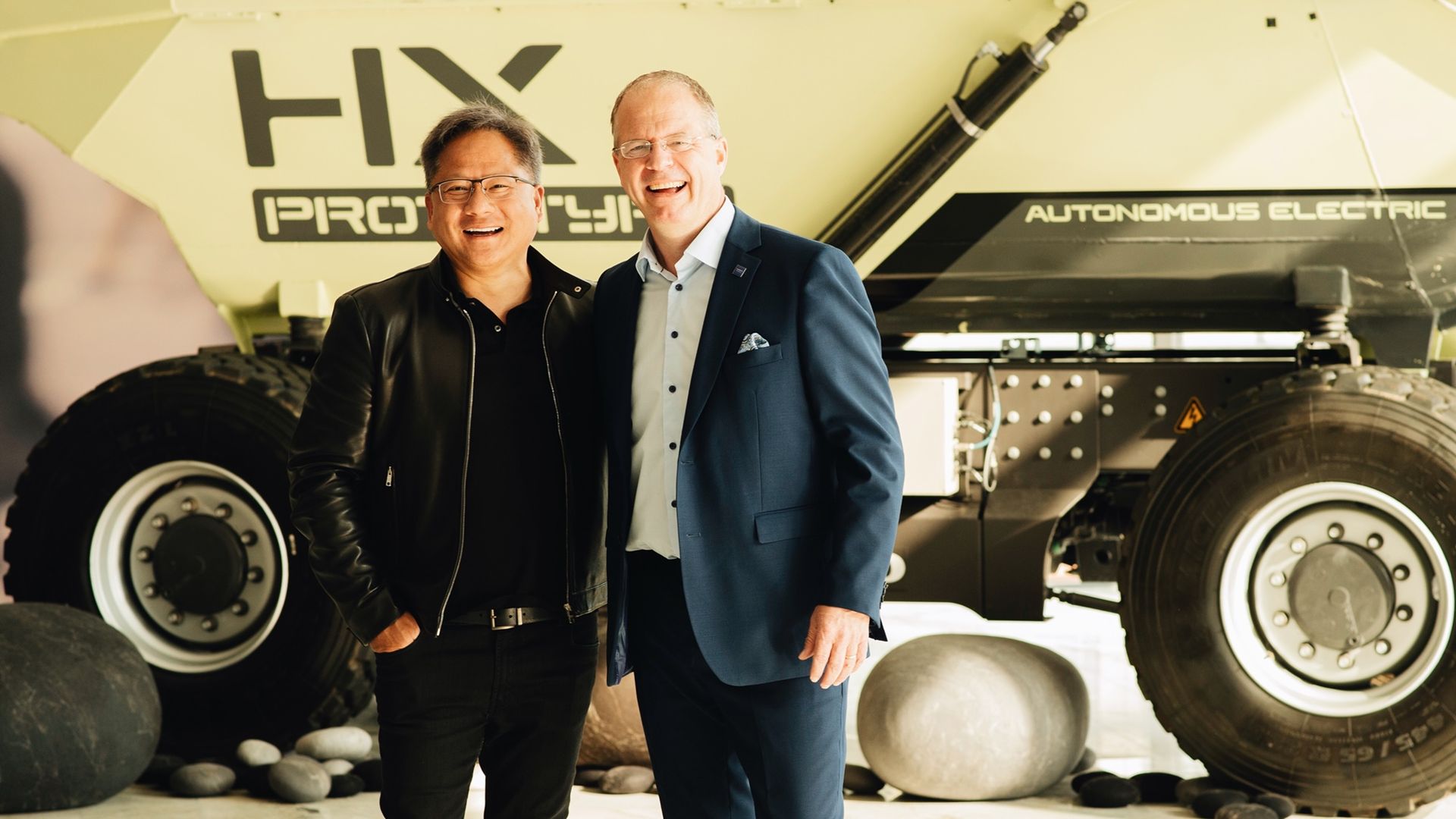 Martin Lundstedt, President and CEO of the Volvo Group, and Jensen Huang, founder and CEO of NVIDIA, stand before a prototype autonomous truck at a Volvo event in Gothenburg Sweden.