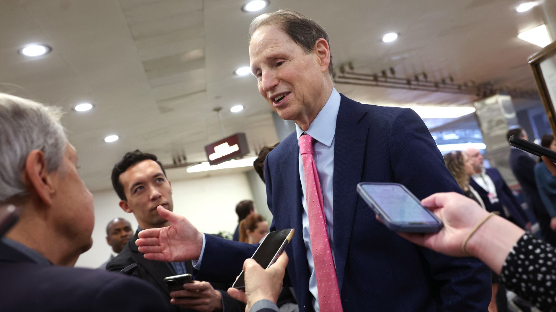 Senator Ron Wyden talks to reporters