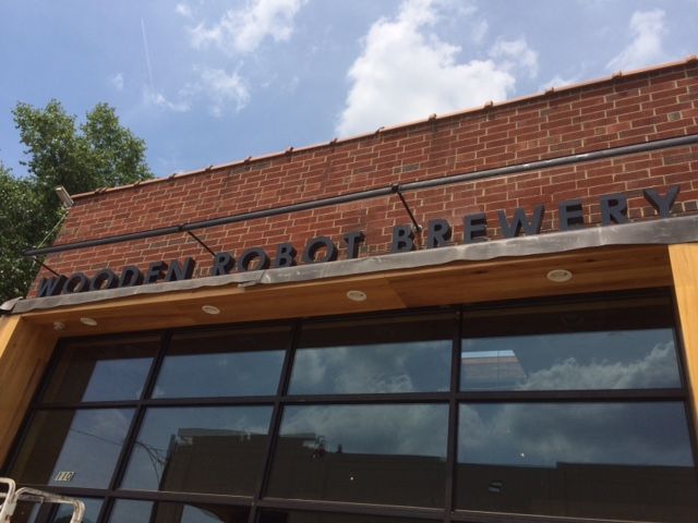 wooden robot signage charlotte